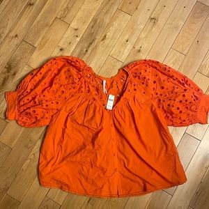 Orange Anthropologie button up top